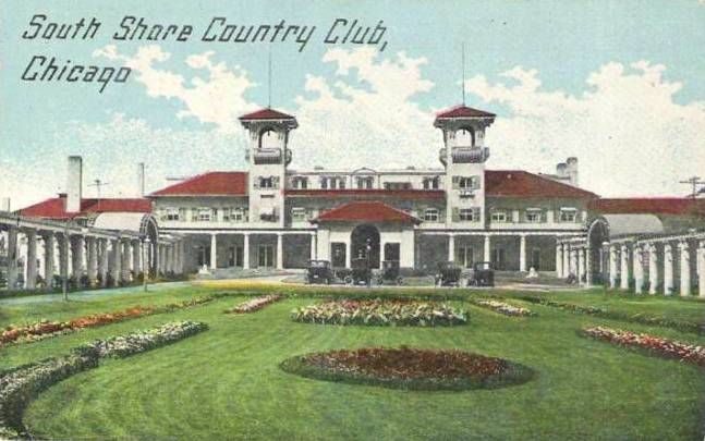 historic postcard illustration that says 'South Shore Country Club, Chicago' on the upper left corner with a front view of the elaborate landscaping and front facade of the Country Club. The building is painted white with a red clay tile roof.